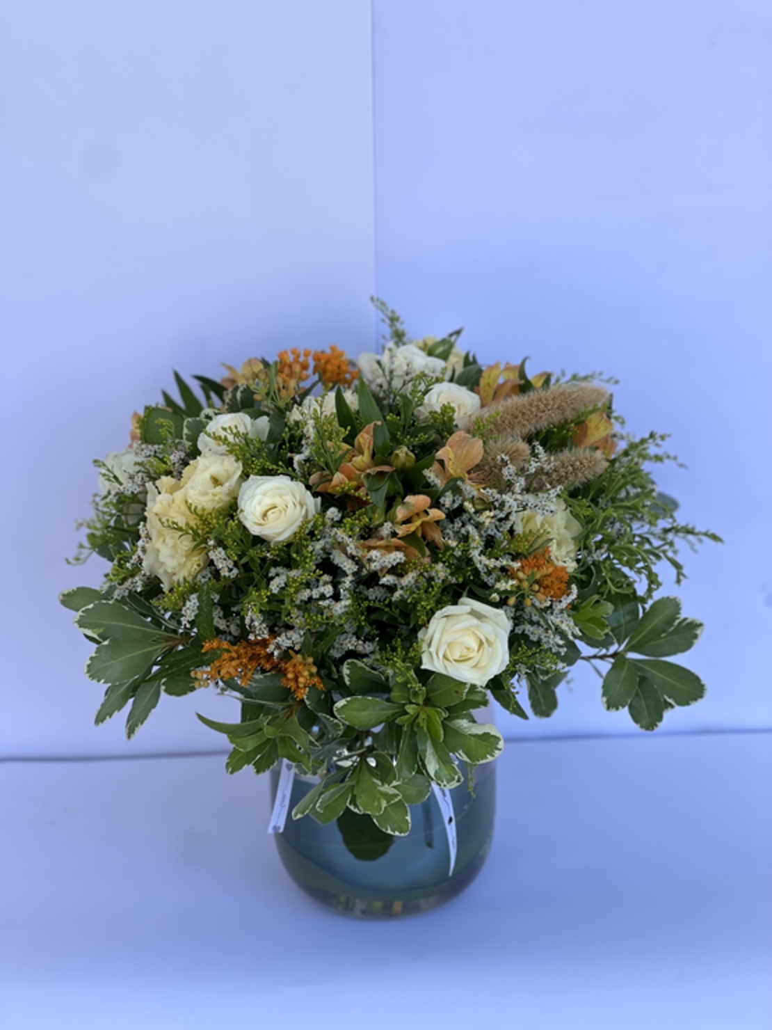 A wild flower arrangement in a vase