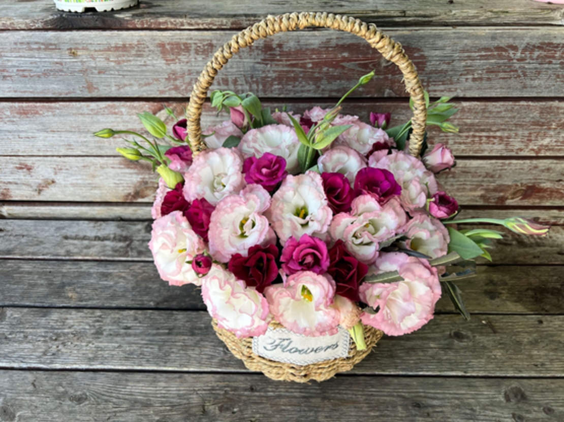 Arrangement of pink flowers in a basket
