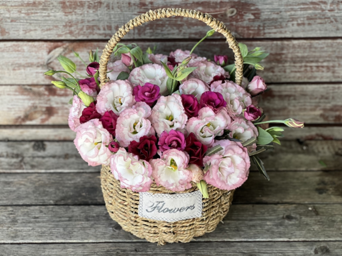 Arrangement of pink flowers in a basket